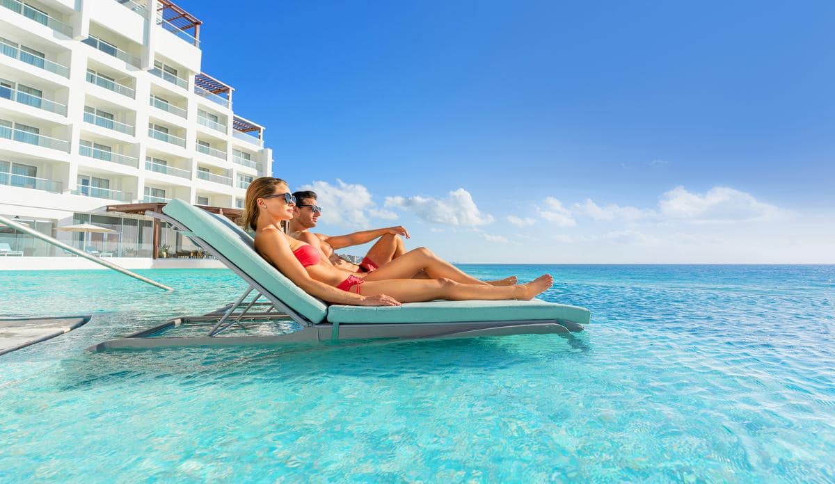 sun-palace_pool_couples_loungers